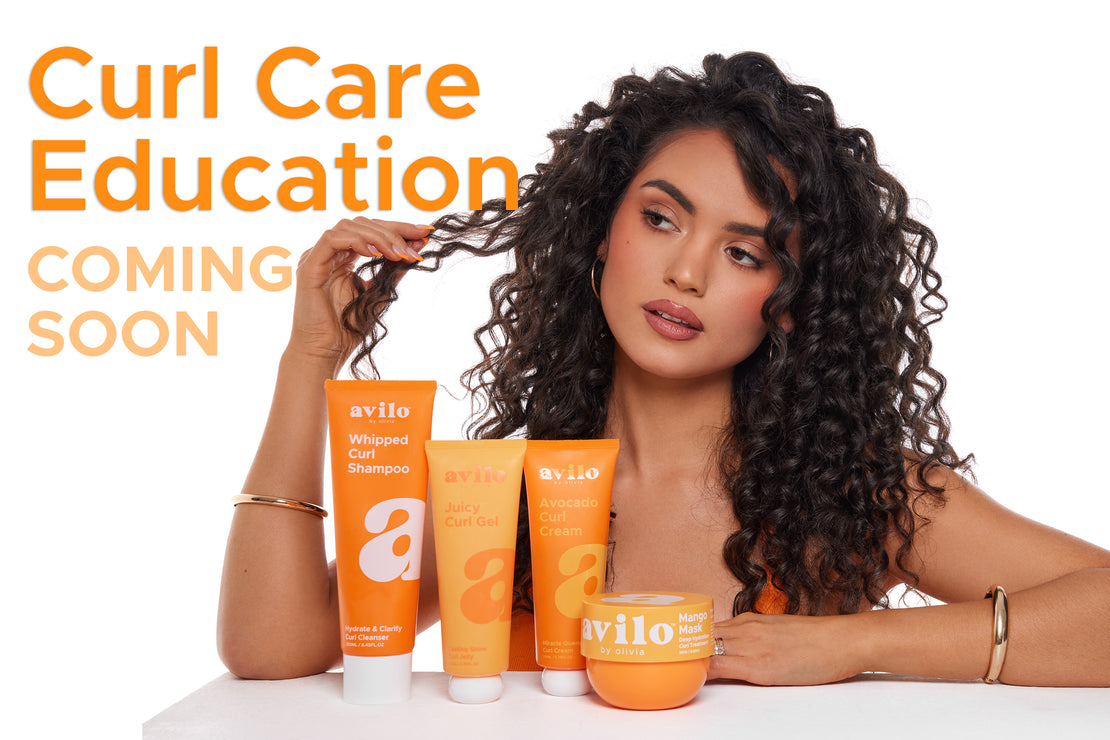 Woman with curly hair holding a bottle of 'avilo' hair care products with text about curl care education.