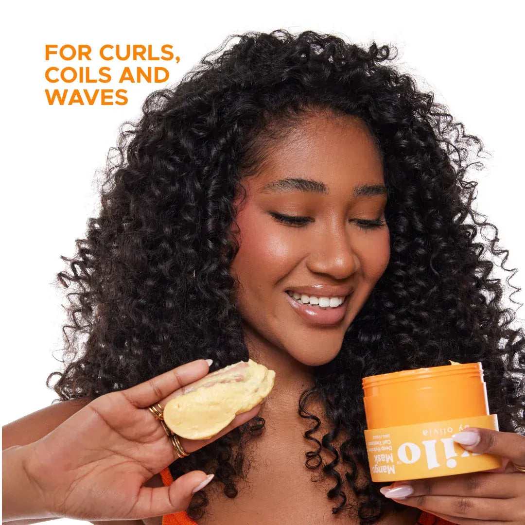 Woman with curly hair holding a jar of hair product with text 'For Curls, Coils and Waves'.