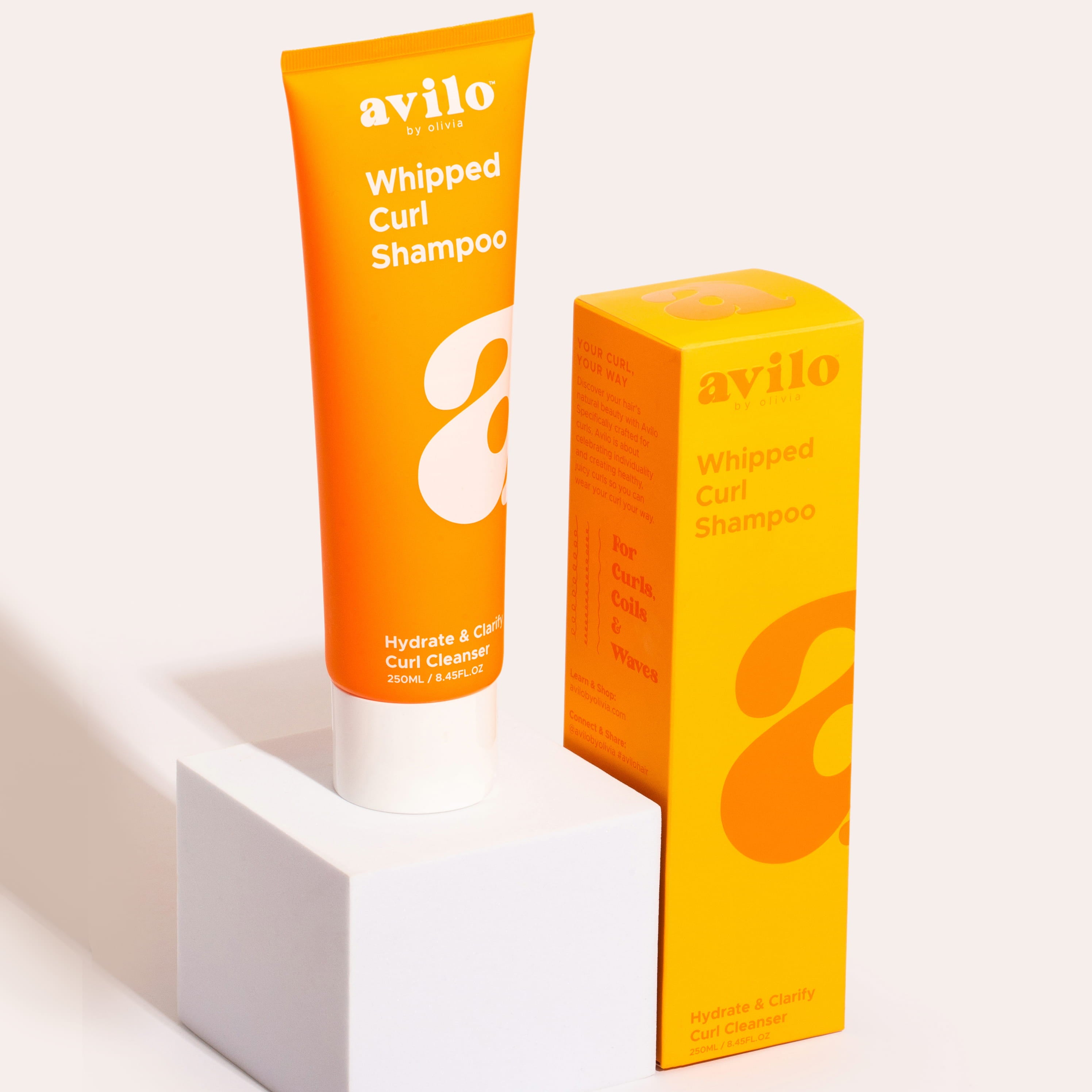 Avilo Whipped Curl Shampoo tube and box on a white background

