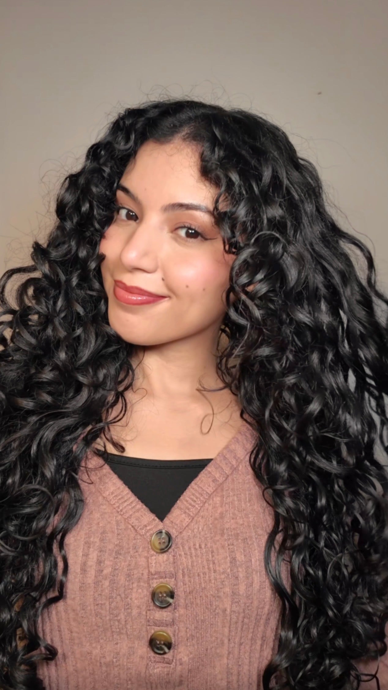 Woman with long, curly black hair