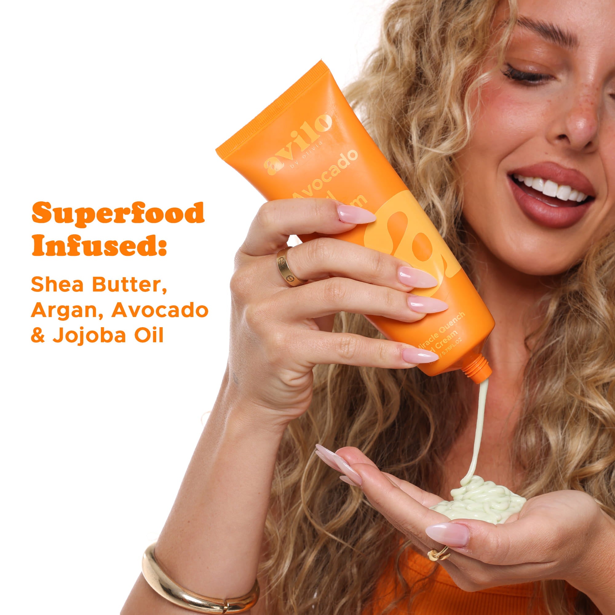 Woman holding an orange bottle of skincare product with text about superfood ingredients.